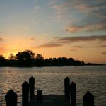 Sun rising over the creek from the dock